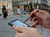 Man making notes on smartphone