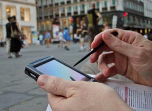 Business traveller working on his smart phone