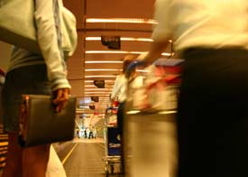 Business people walking through airport