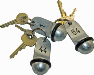 Three set of hotel keys with room numbers on them