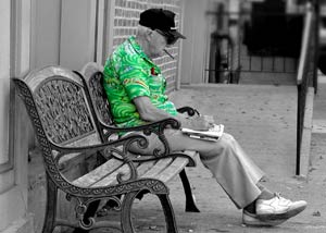 Senior citizen sitting on a bench