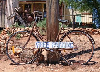 Bicycle parked against lamp post