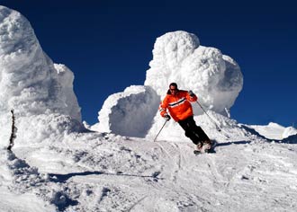 Man snow skiing down a mountain