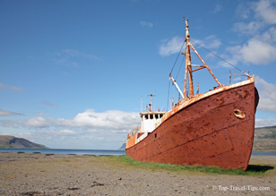 Old trawler on a beach in Iceland