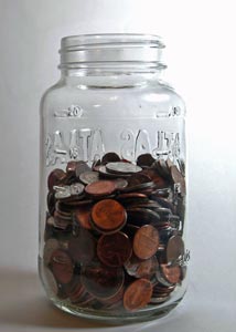 Tips to save money - Jar of coins Small coins in a jar