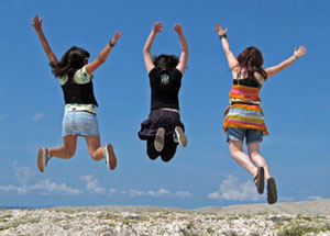 Three teenagers jumping