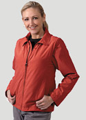 Woman wearing red colored Scottevest carryon luggage vest