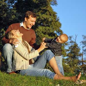 Parents playing with their young kid