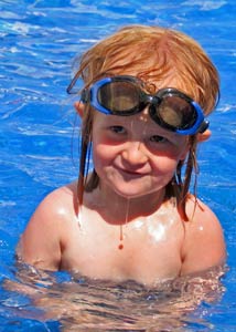 Kid smiling in swimming pool
